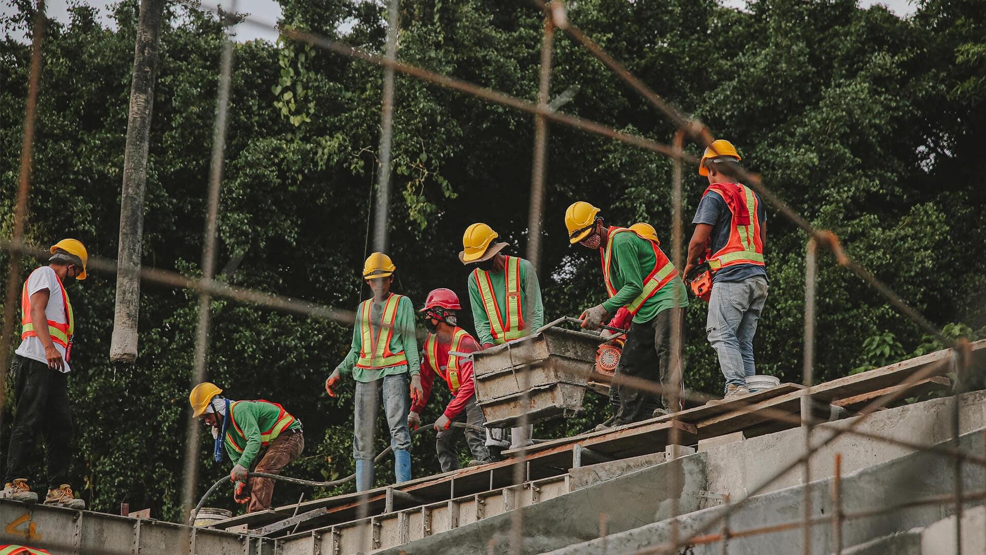 An image of people working on a roof.